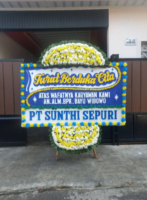 Papan Bunga Duka di Batu Meja