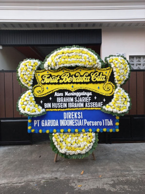 Papan Bunga Duka di Batu Meja