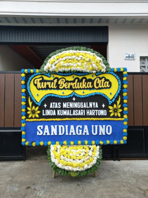 Papan Bunga Duka di Batu Meja
